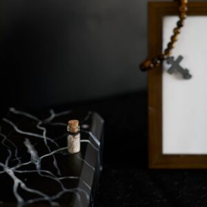 funeral , a glass pendant with ashes in the form of a bottle, memorial